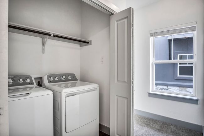 Laundry closet upstairs and washer and dryer convey | Image 14