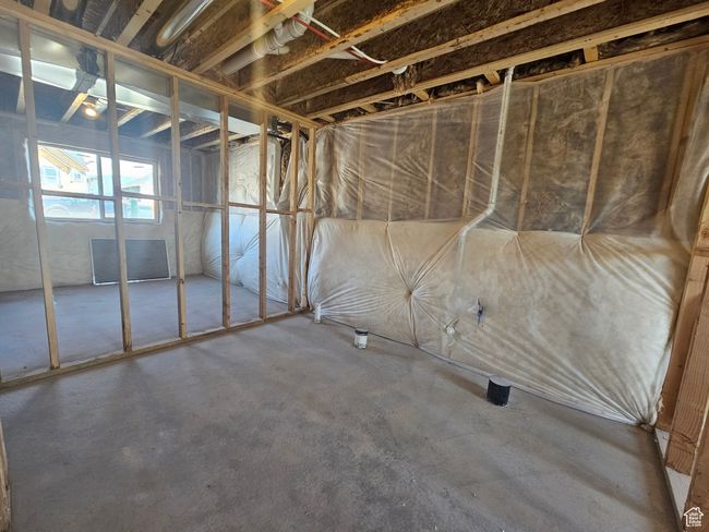 Misc room with concrete flooring | Image 26