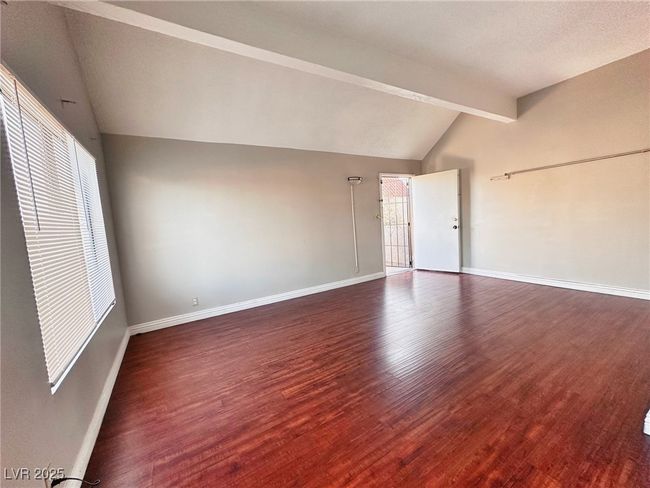 Empty room featuring wood finished floors and baseboards | Image 13