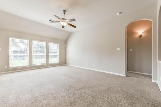 living area with view of hallway to primary | Image 12