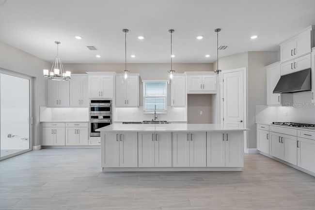 Floor Plan - Structural options added include: bay windows to primary suite, study with pocket doors in place of a flex room, tandem garage, gourmet kitchen, covered extended lanai with outdoor kitchen rough-in. | Image 31