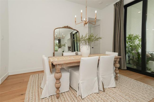 Expansive sliding glass doors invite abundant natural light and seamless indoor-outdoor living. | Image 11