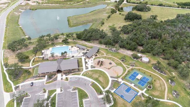 Aerial view of community amenities and pond | Image 37