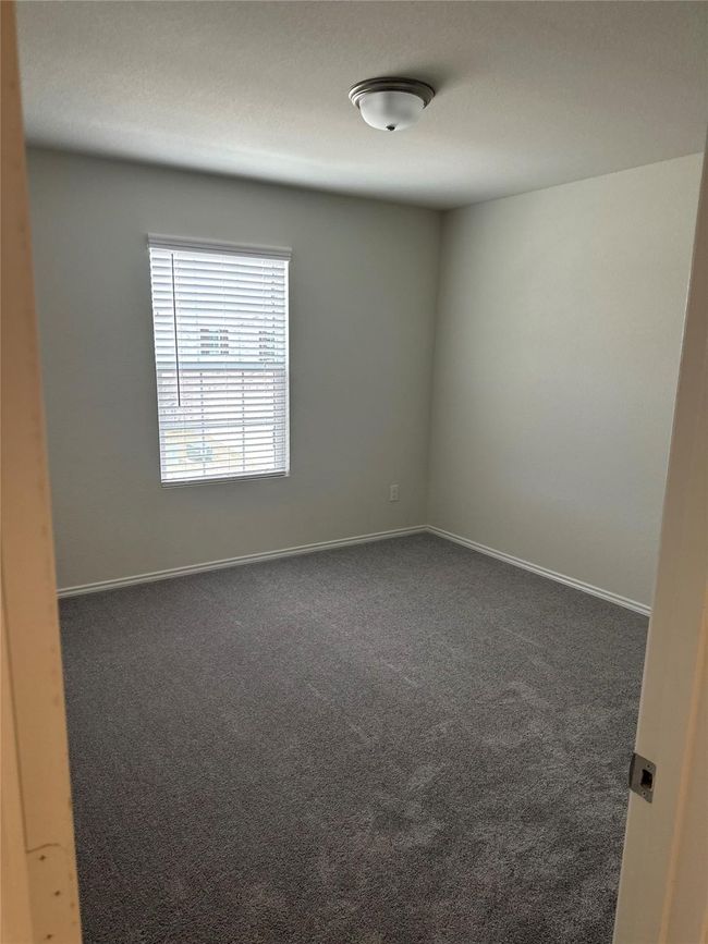 Spare room featuring carpet | Image 21