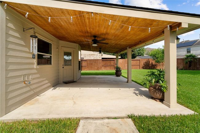 Nice size 21 X 15 outdoor patio with ceiling fans and lighting, perfect for entertaining. | Image 34