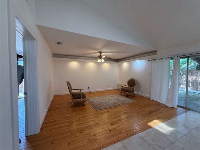 Sitting room with wood-type flooring and ceiling fan | Image 7