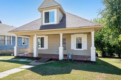 Bungalow-style house featuring a front lawn and a porch | Image 1