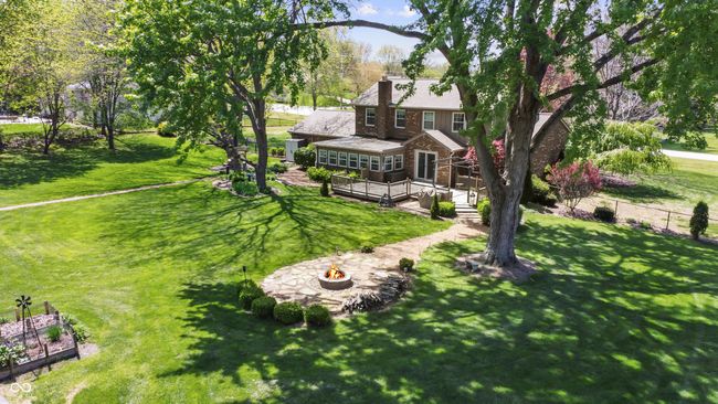 exterior space with a wooden deck and an outdoor fire pit | Image 32