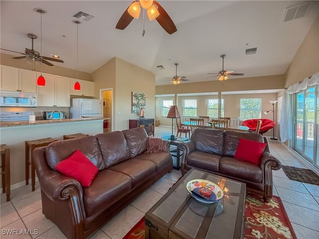 Living room featuring plenty of natural light and visible vents | Image 19
