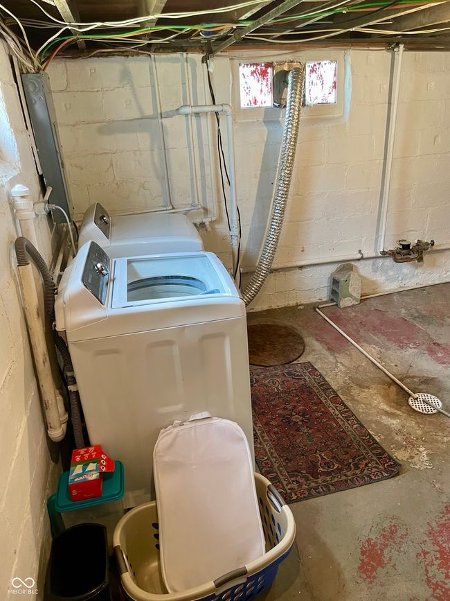 laundry room featuring laundry area and washing machine and dryer | Image 22