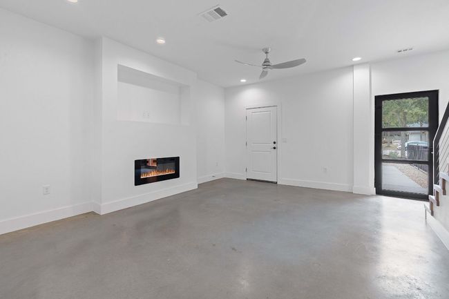 Unfurnished living room with visible vents, recessed lighting, finished concrete floors, and a ceiling fan | Image 9
