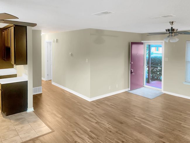 View from kitchen into living room and entry. | Image 5
