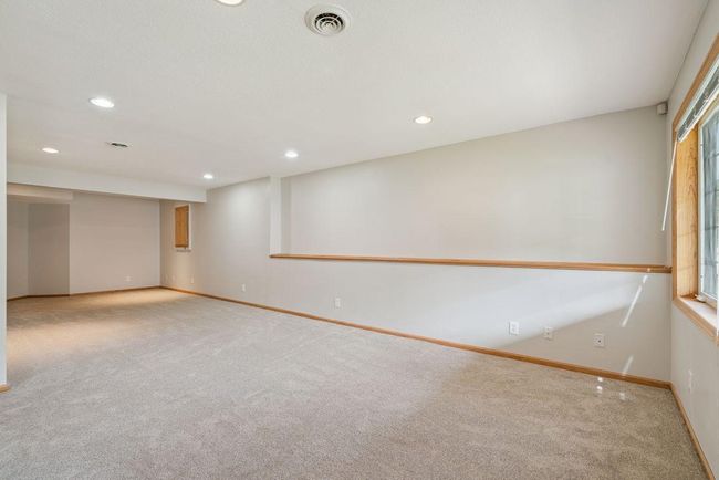 Large (34x13) walkout lower level family room, freshly painted, new carpet, outside leads to back patio, recessed lights. | Image 22