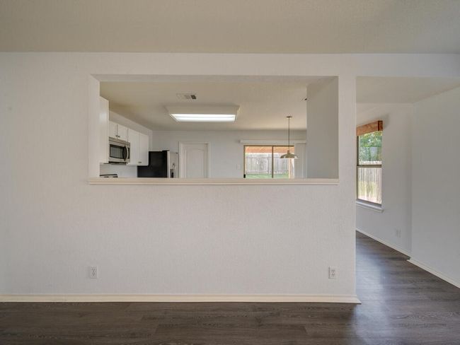 View from living room into kitchen. | Image 8