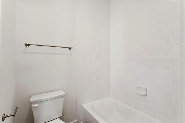 Bathroom featuring toilet and washtub / shower combination | Image 25