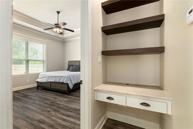 This photo highlights the built-in desk space located between the kitchen and the primary bedroom—perfect for homework, paying bills, or jotting down your grocery list. | Image 16