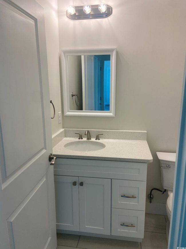 Bathroom with vanity and tile patterned floors | Image 21