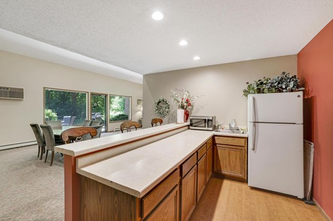 The party room offers a refrigerator and microwave along with supplies in the cabinetry for your get togethers. | Image 20