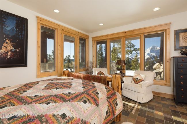 Entry level Bedroom 2 with Lone Mountain views and door to exterior patio seating. | Image 55