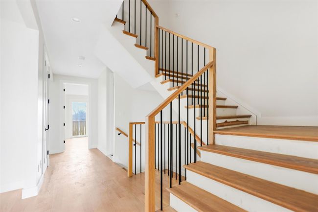 Stairs featuring hardwood / wood-style flooring | Image 35