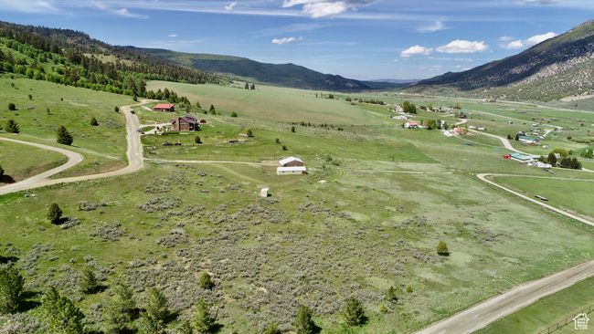View of property location with rural landscape, a mountain backdrop, and agricultural land | Image 6