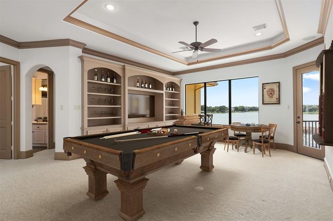 A spacious flex room offers endless possibilities perfect as a media room, game room, fitness space, or guest retreat--- tailored to fit your lifestyle needs. Virtually staged. | Image 27