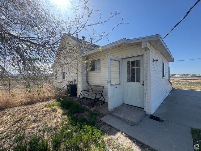 View of outbuilding with central AC and fence | Image 6