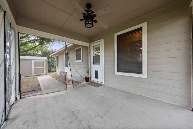 View of patio with a storage shed | Image 30