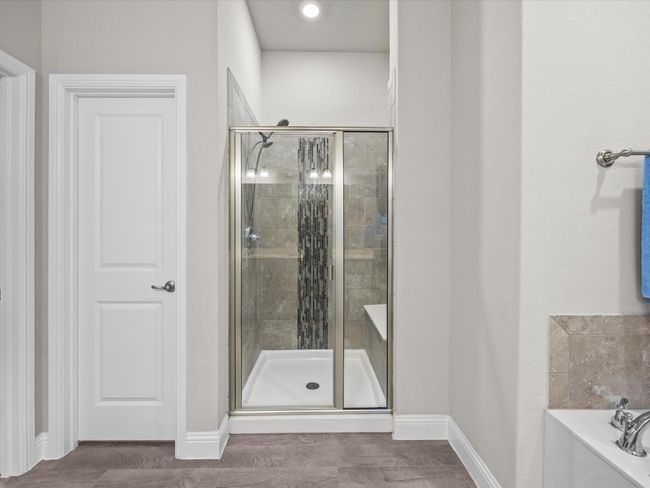Bathroom featuring a shower stall and a garden tub | Image 19
