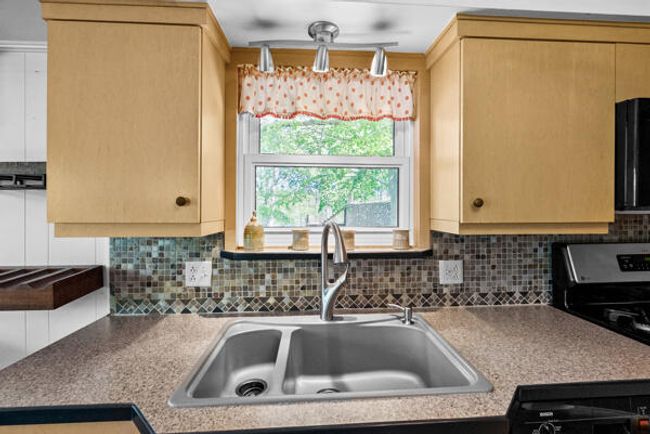 Kitchen sink view | Image 11