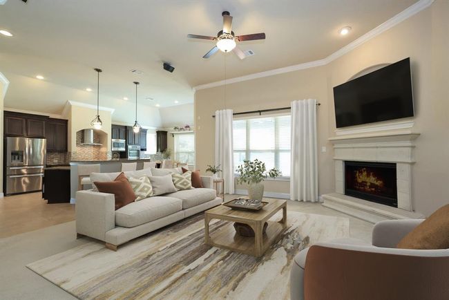 Cast stone fireplace with mantle and raised hearth. | Image 24