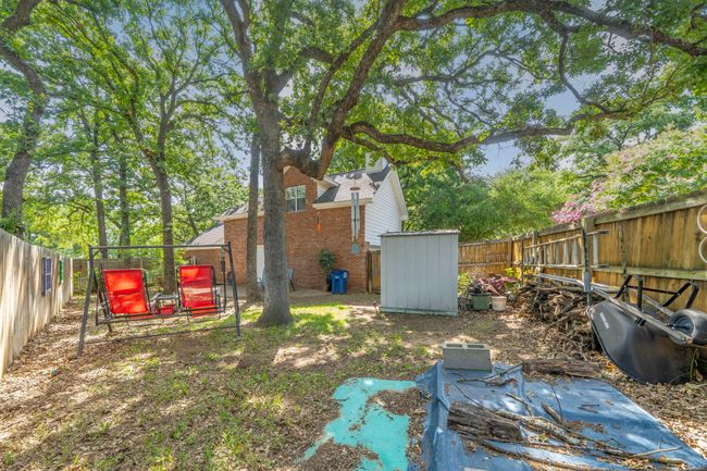 2nd Fenced backyard area with a storage shed | Image 31