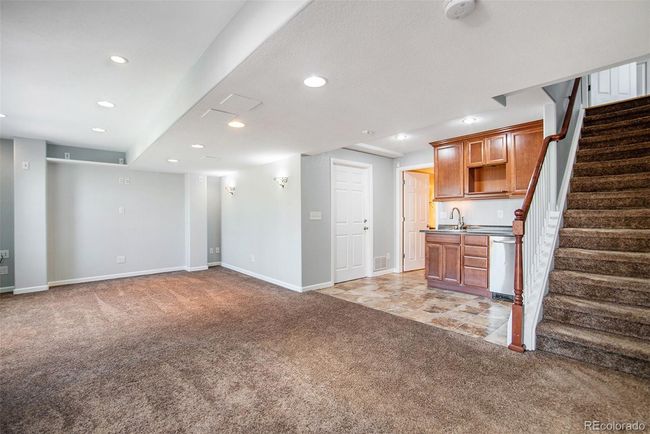 Basement Living Room with Bar Area | Image 19