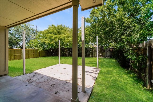 Fenced backyard featuring a patio area | Image 26