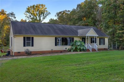 Ranch-style home with a front lawn | Image 3