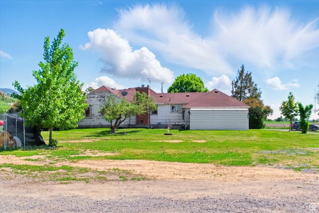 Back of house with a lawn | Image 27