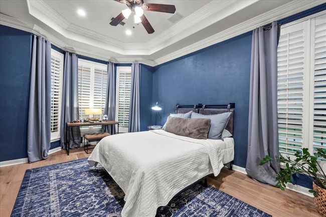 Another spacious secondary bedroom with dramatic navy walls and bay windows—perfect for a teen retreat, guest space, or flex room. | Image 30