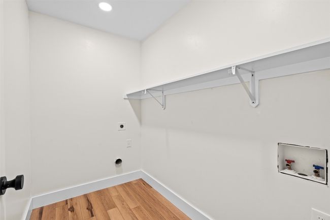 Laundry room with hookup for a washing machine, baseboards, light wood-type flooring, hookup for an electric dryer, and recessed lighting | Image 26