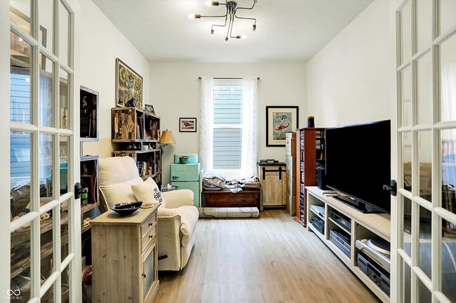 Flex room with French doors, room could be used as office or guest space | Image 10