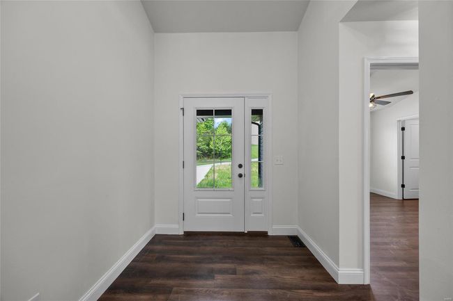 Foyer entrance featuring baseboards and dark wood-type flooring | Image 10