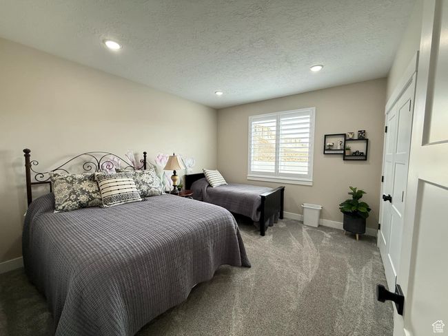 Carpeted bedroom with baseboards, recessed lighting, and a textured ceiling | Image 56