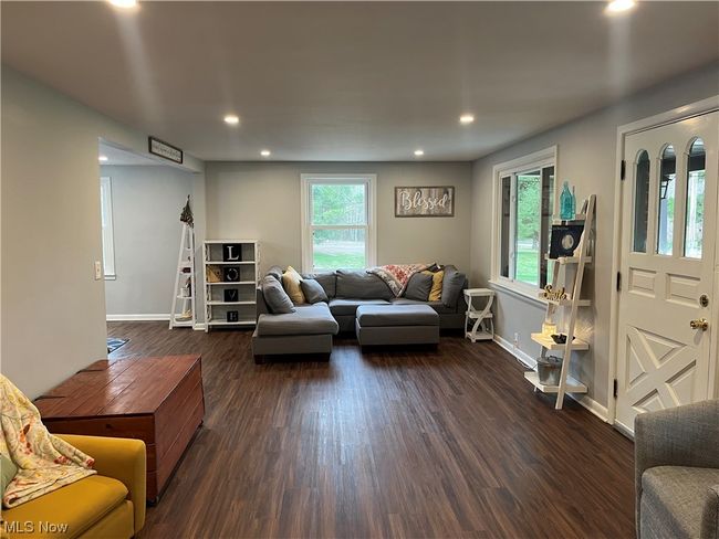Living room featuring dark hardwood / wood-style flooring | Image 8