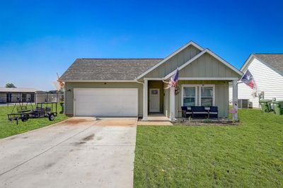 View of front of house with central AC and a front yard | Image 2