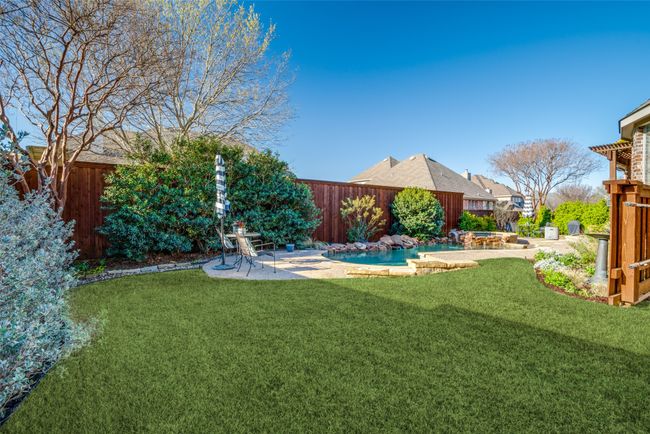 View of yard featuring a pool & enough room for playset or trampoline | Image 4