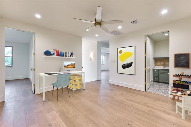 Versatile upstairs landing offers the perfect space to entertain, work, or unwind with play! Virtually staged. | Image 33