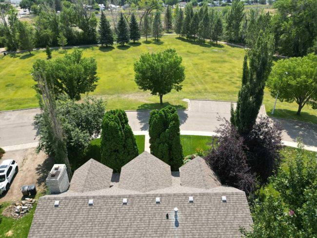 24 Evergreen Park Close W, Home with 4 bedrooms, 3 bathrooms and 5 parking in Brooks AB | Image 5