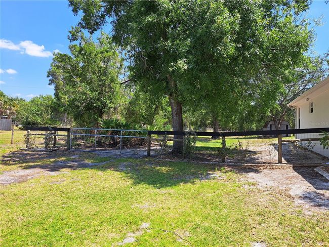 Side yard entrance with 16ft gate to pull in and secure trailers, boats, etc. | Image 30