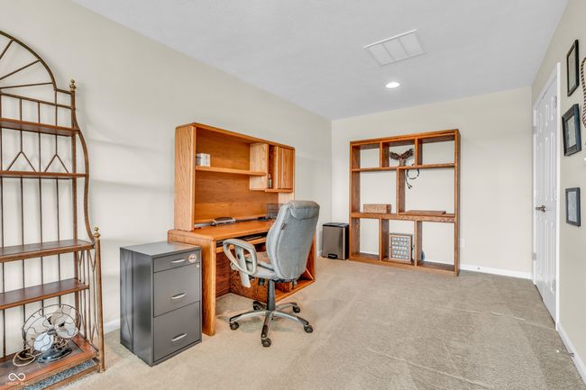 spacious bonus has enough room for an office space | Image 41