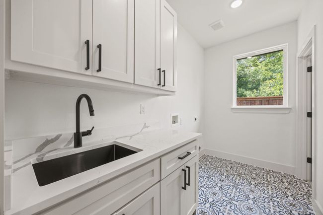 Laundry room with hookup for an electric dryer, hookup for a washing machine, cabinet space, baseboards, and recessed lighting | Image 28
