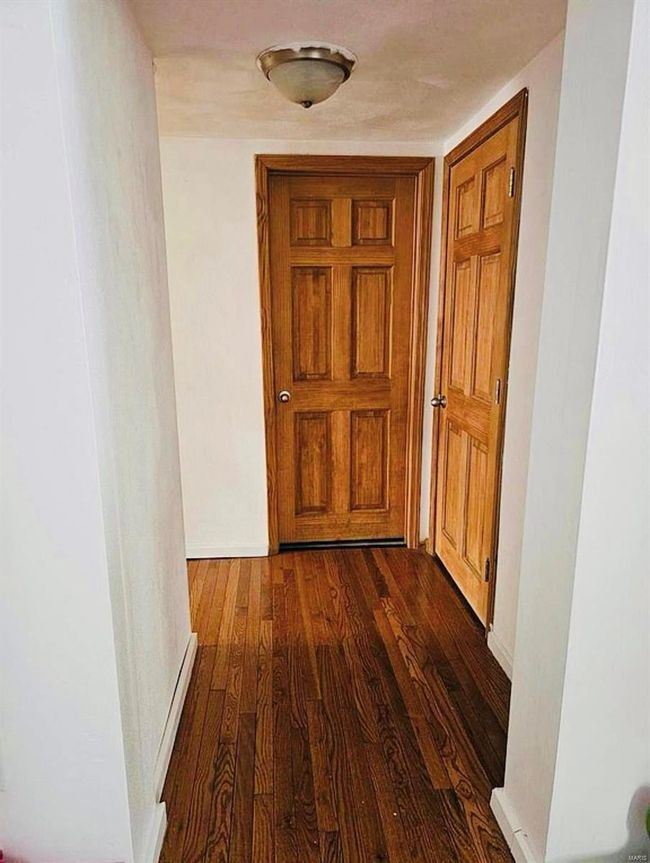 Hallway featuring dark wood finished floors | Image 9